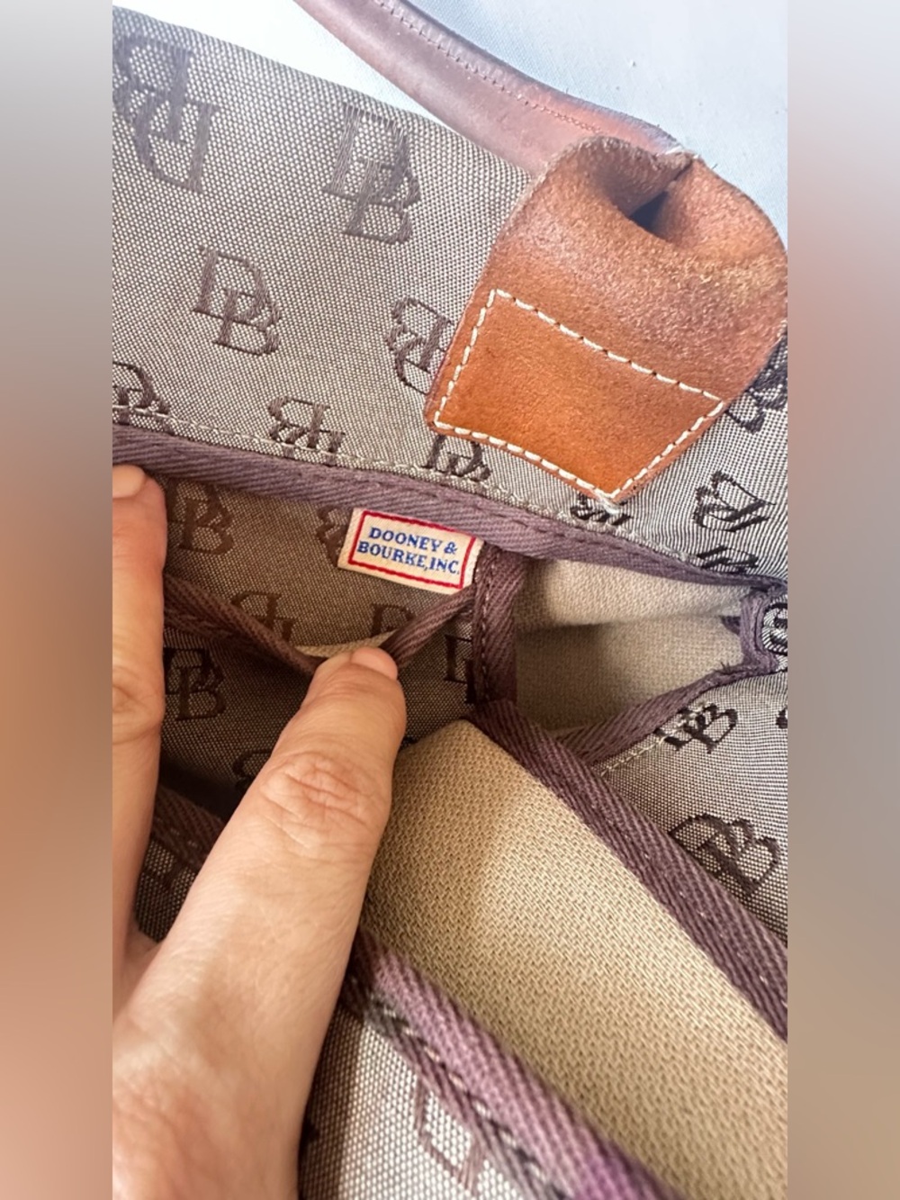 Dooney & Bourke monogram canvas and leather drawstring tote bag. - Picture 10 of 11